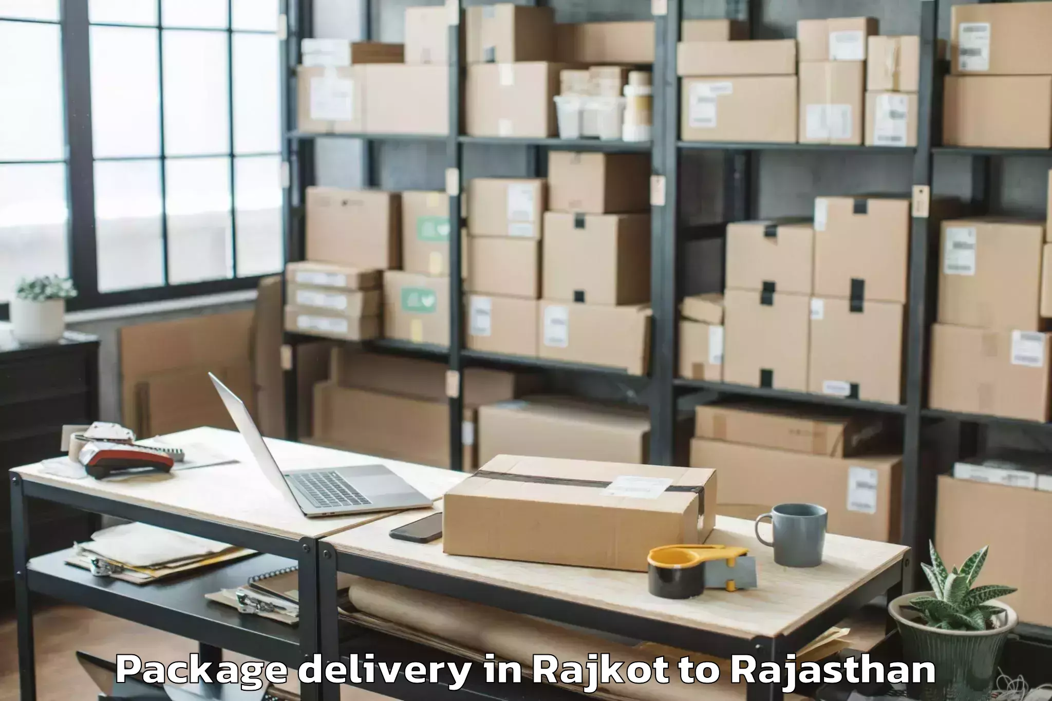 Top Rajkot to Pratap University Jaipur Package Delivery Available